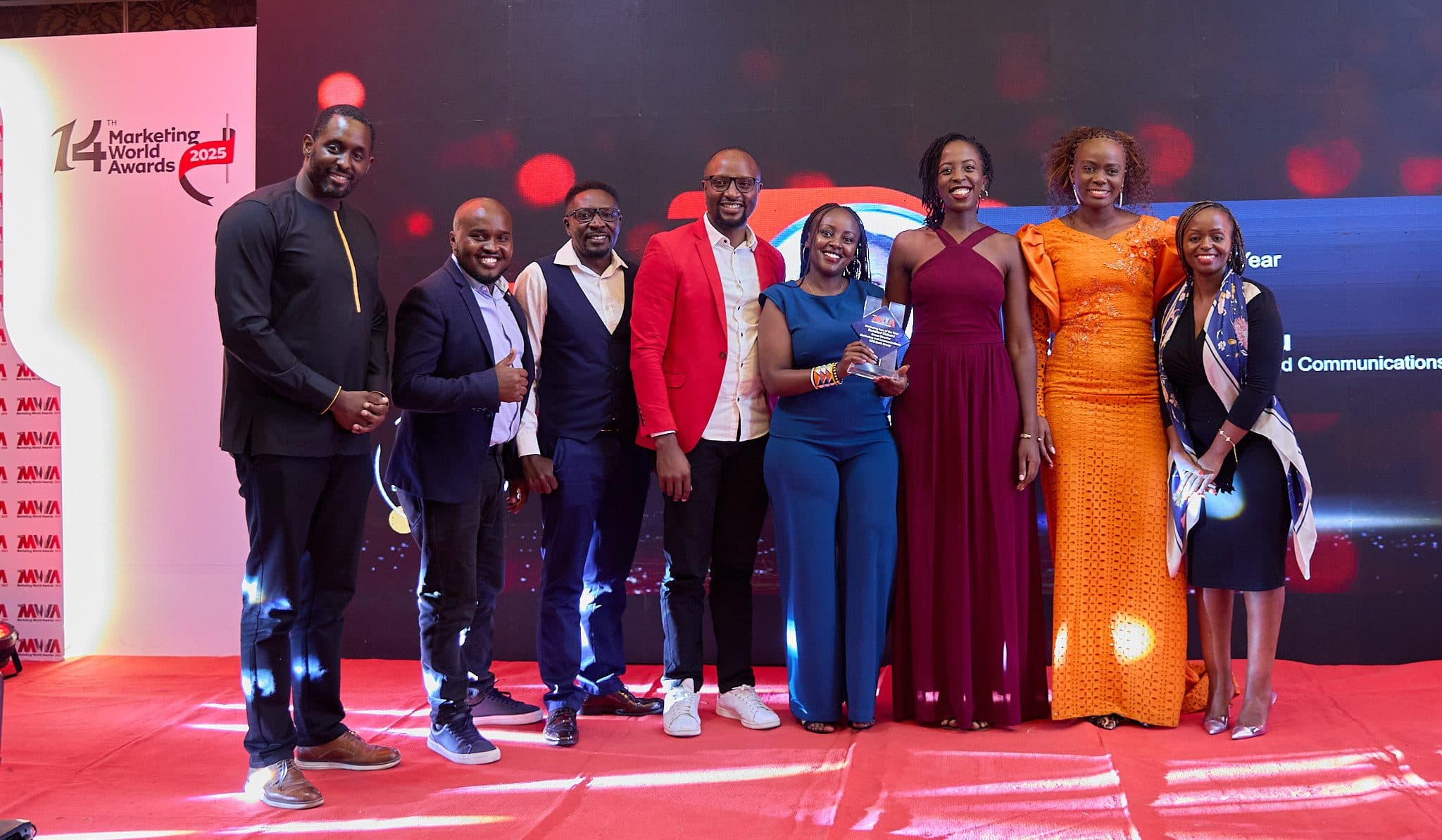 A team of leaders accepting an award together on stage