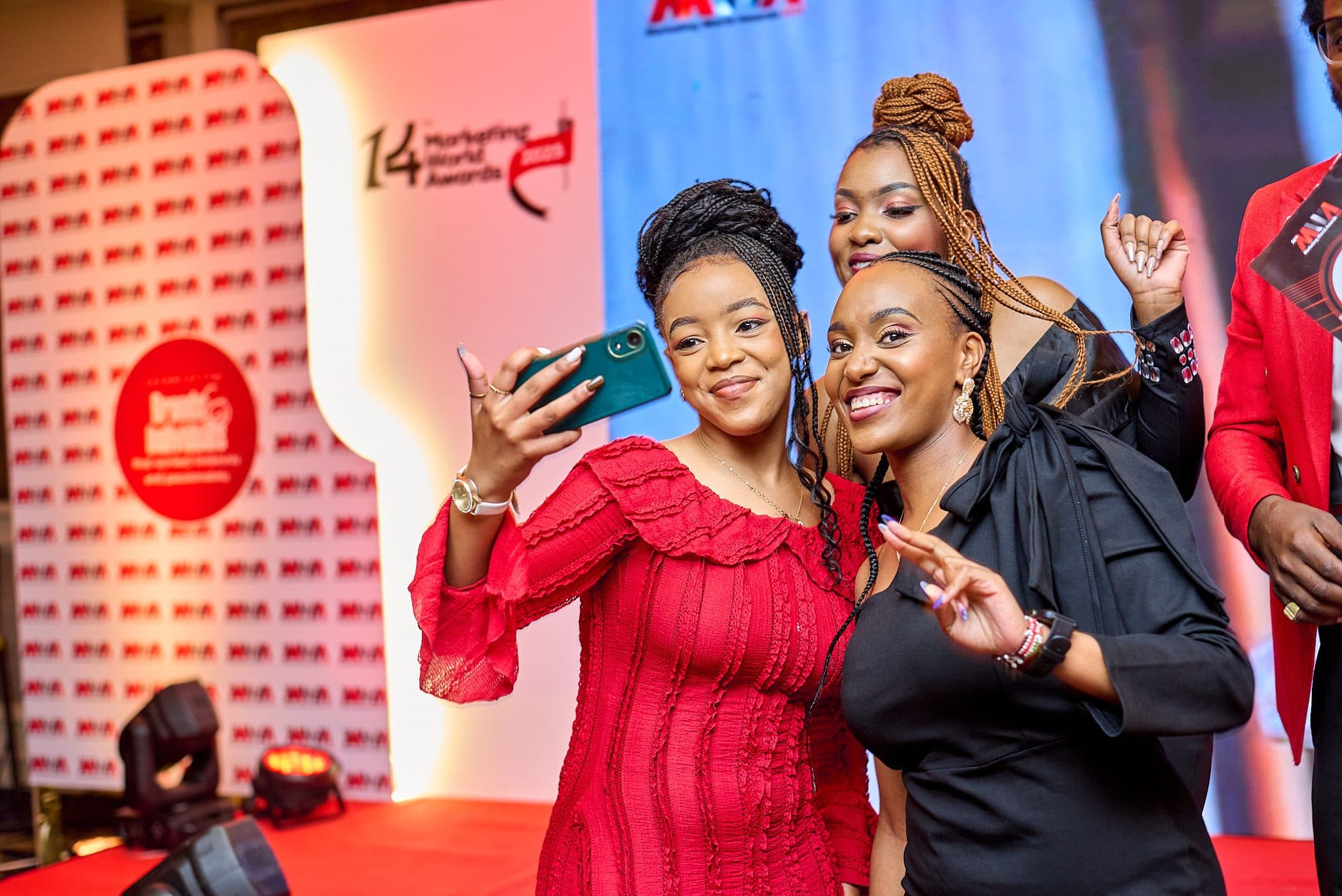 Guests capturing the moment on stage at the Marketing World Awards
